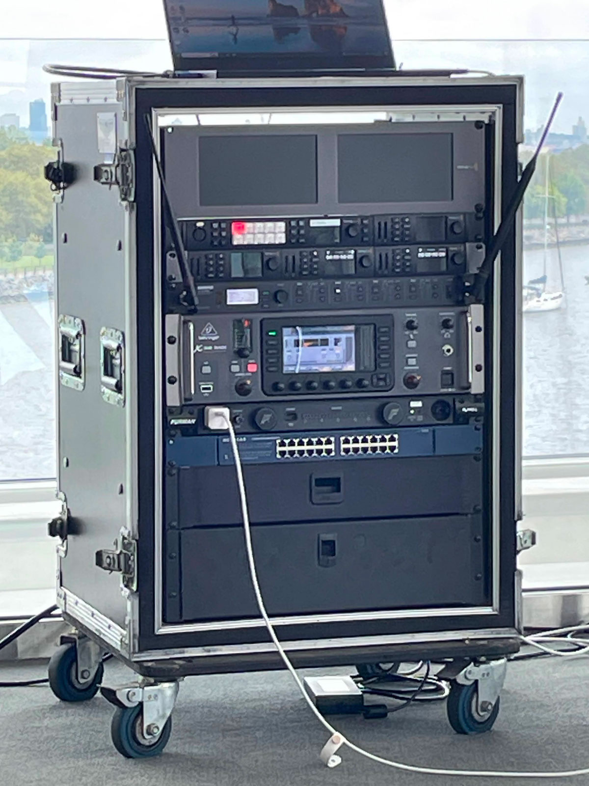 Professional AV equipment rack with live streaming encoder and wireless microphone system for corporate event New Jersey