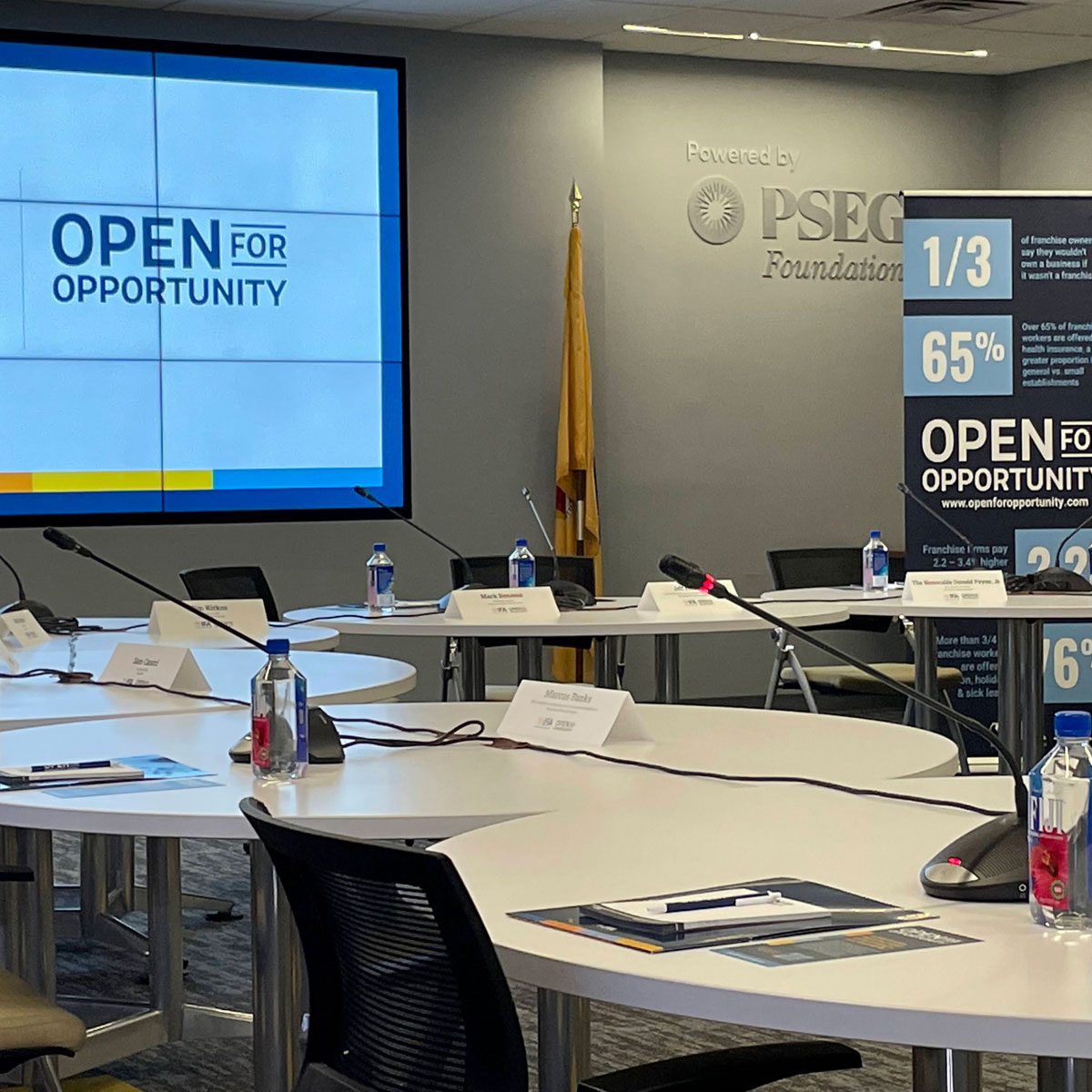 Corporate meeting AV setup with video wall display and conference microphones Ocean County New Jersey