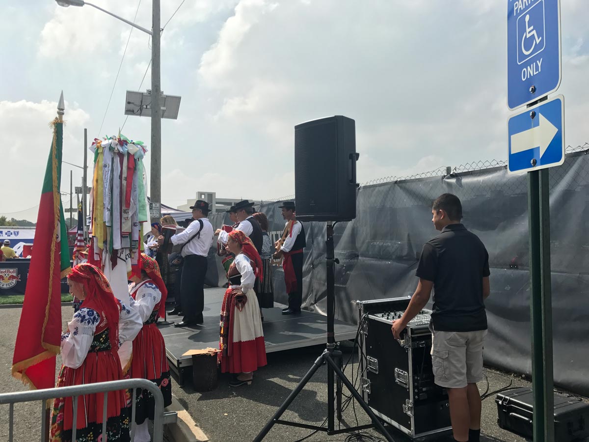 Outdoor festival sound system with PA speaker and AV technician at cultural event Ocean County New Jersey